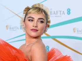 See Florence Pugh in a Sculptural Orange Ruffle Gown at the BAFTAs