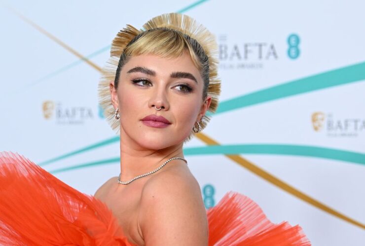 See Florence Pugh in a Sculptural Orange Ruffle Gown at the BAFTAs