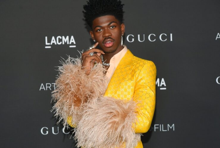 Lil Nas X Celebrates 24th Birthday in Sheer Jumpsuit and Poodle Coat – WWD