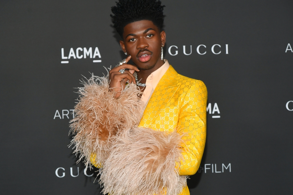 Lil Nas X Celebrates 24th Birthday in Sheer Jumpsuit and Poodle Coat – WWD