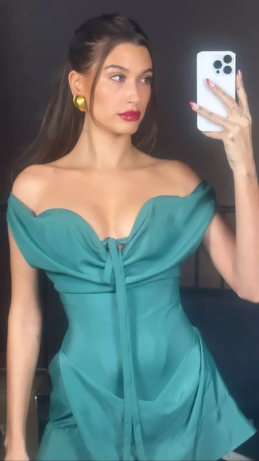 Hailey Bieber wears a green Vivienne Westwood dress from the brand's spring/summer 2023 collection.