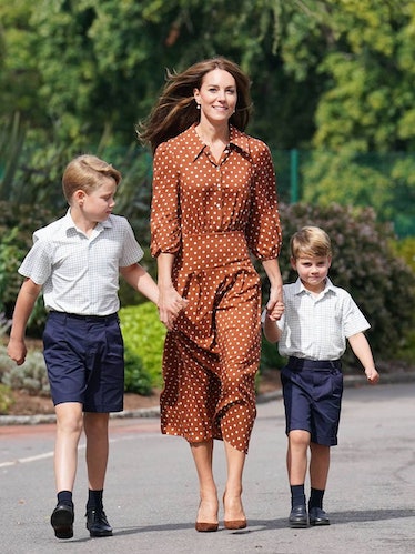 Kate Middleton wears a brown polka dot Rixon dress.