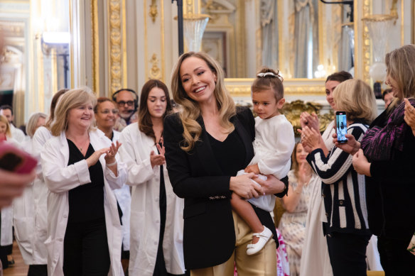 Triumphant return: Sydney’s Tamara Ralph takes Paris by storm at her fashion show this week, pictured with daughter Haliya.