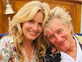 Penny Lancaster is a sunkissed vision in plunging beach dress