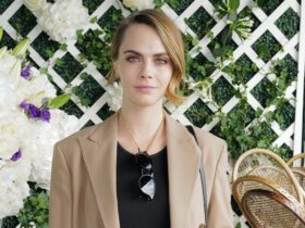 Cara Delevingne Dons Combat Boots & Ralph Lauren Blazer at Wimbledon – Footwear News