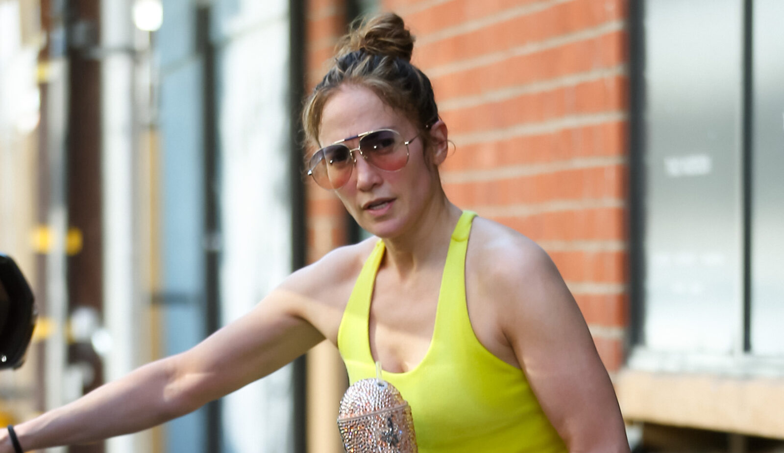 Jennifer Lopez Gets Sporty in Neon Snake Leggings & Naked Wolfe Shoes – Footwear News