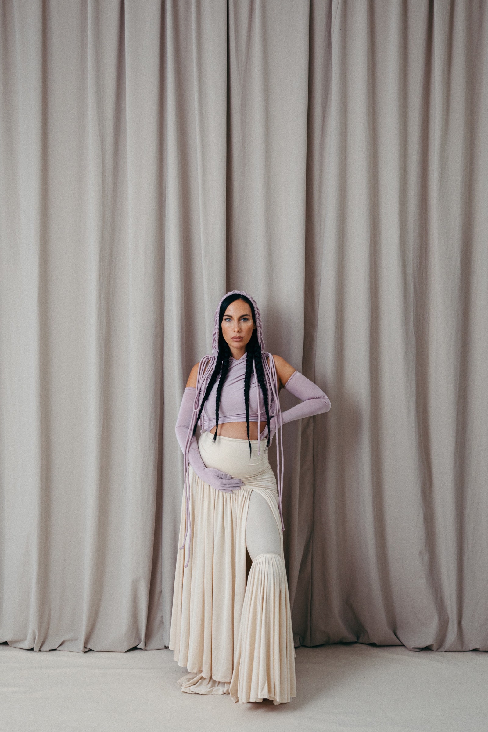 A woman in a purple and white outfit