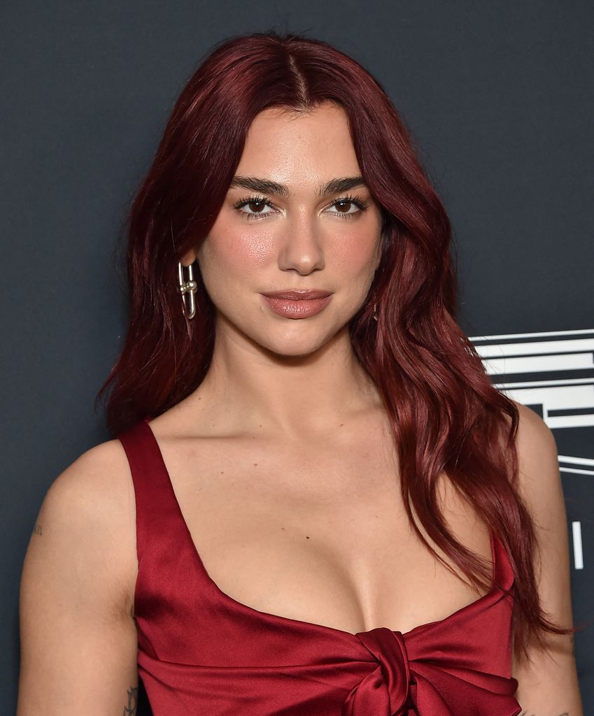 Dua Lipa in red satin dress