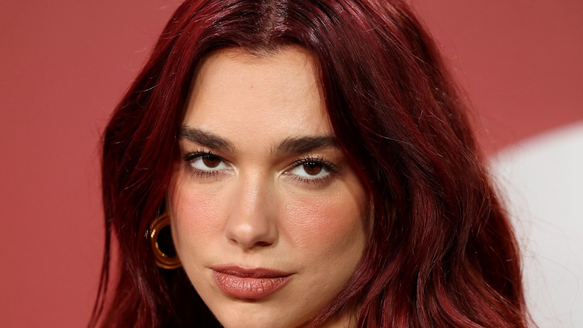 Dua Lipa stuns in short shorts and sheer stockings for Tokyo outing