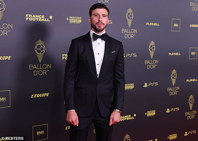 Man City defender Rodri adopted a traditional tuxedo as he posed ahead of the Ballon d'Or