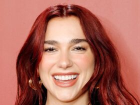 Dua Lipa is a scarlet mermaid in skintight satin dress after hair transformation