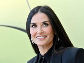 At 60, Demi Moore Shows Off Toned Abs in Black String swimsuit Waterfall Pic