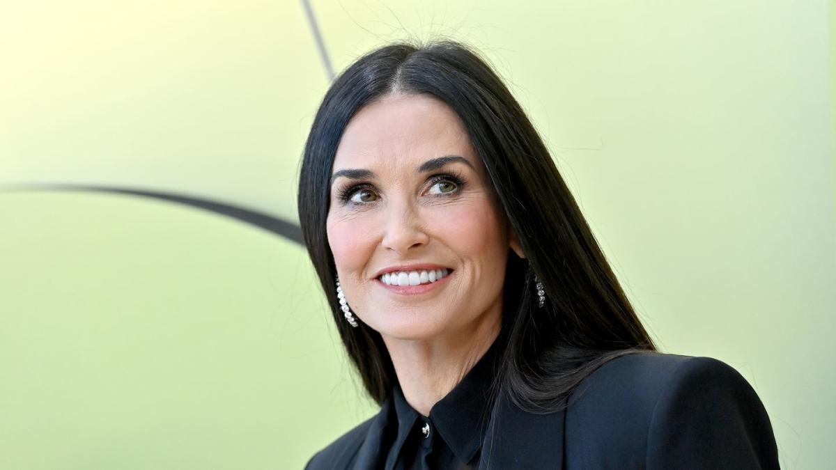 At 60, Demi Moore Shows Off Toned Abs in Black String swimsuit Waterfall Pic