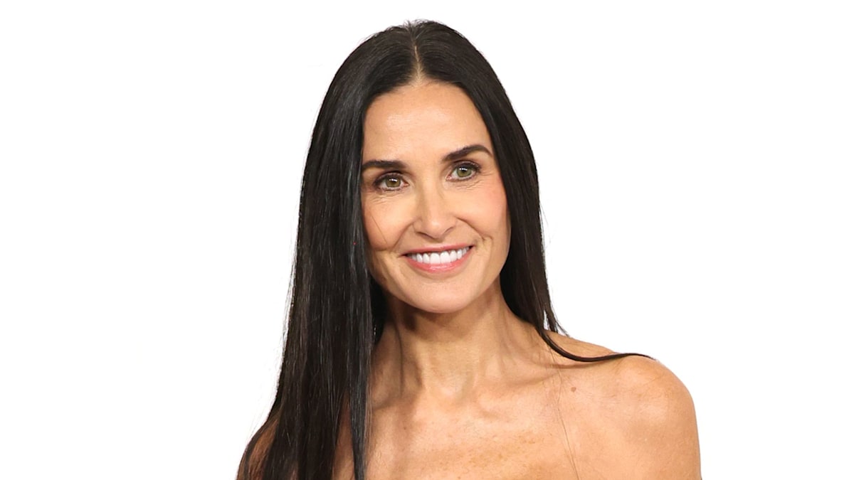 Demi Moore, 60, defies expectations in glitterball dress and vampy waist-length hair